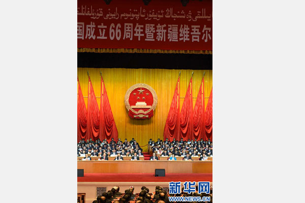 10月1日，慶祝中華人民共和國成立66周年暨新疆維吾爾自治區(qū)成立60周年大會在新疆人民會堂隆重舉行。 新華社記者 高潔 攝 