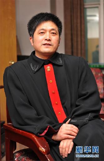 （圖文互動）其人如蘭，既潔且馨——追記“全國模范法官”胡國運