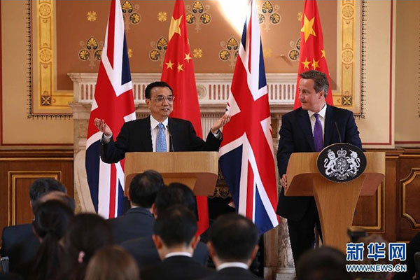     6月17日，國務(wù)院總理李克強(qiáng)同英國首相卡梅倫在倫敦舉行中英總理年度會晤后共同會見記者。 新華社記者 龐興雷 攝 